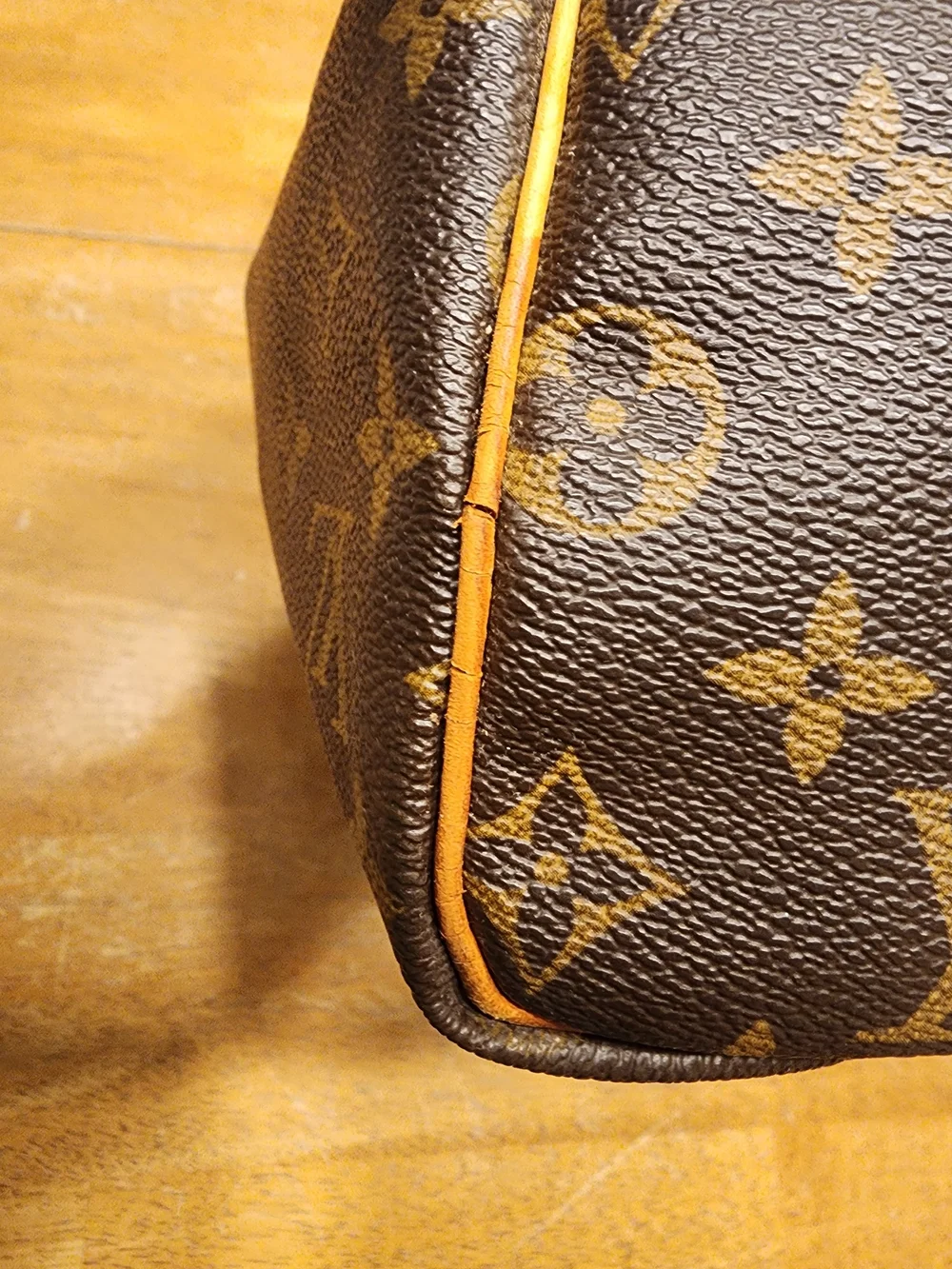 classic Louis Vuitton Monogram Speedy 30 featuring iconic brown coated monogram